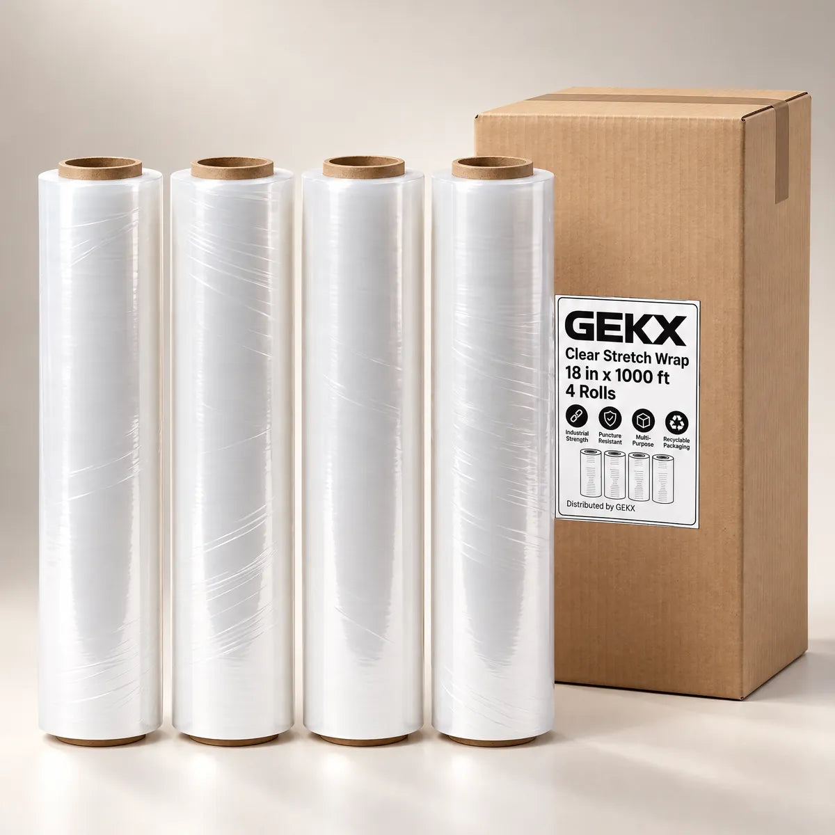 Four GEKX clear stretch wrap rolls standing beside a closed GEKX 4-roll shipping box on a light background